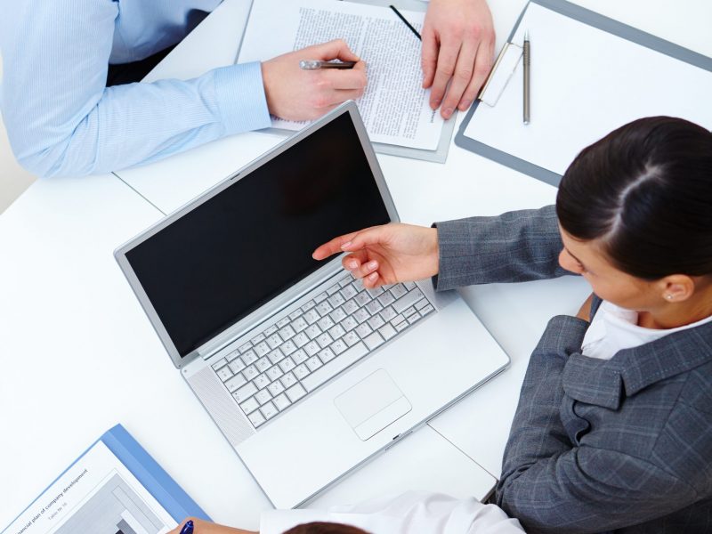 Above view of business partners working at meeting